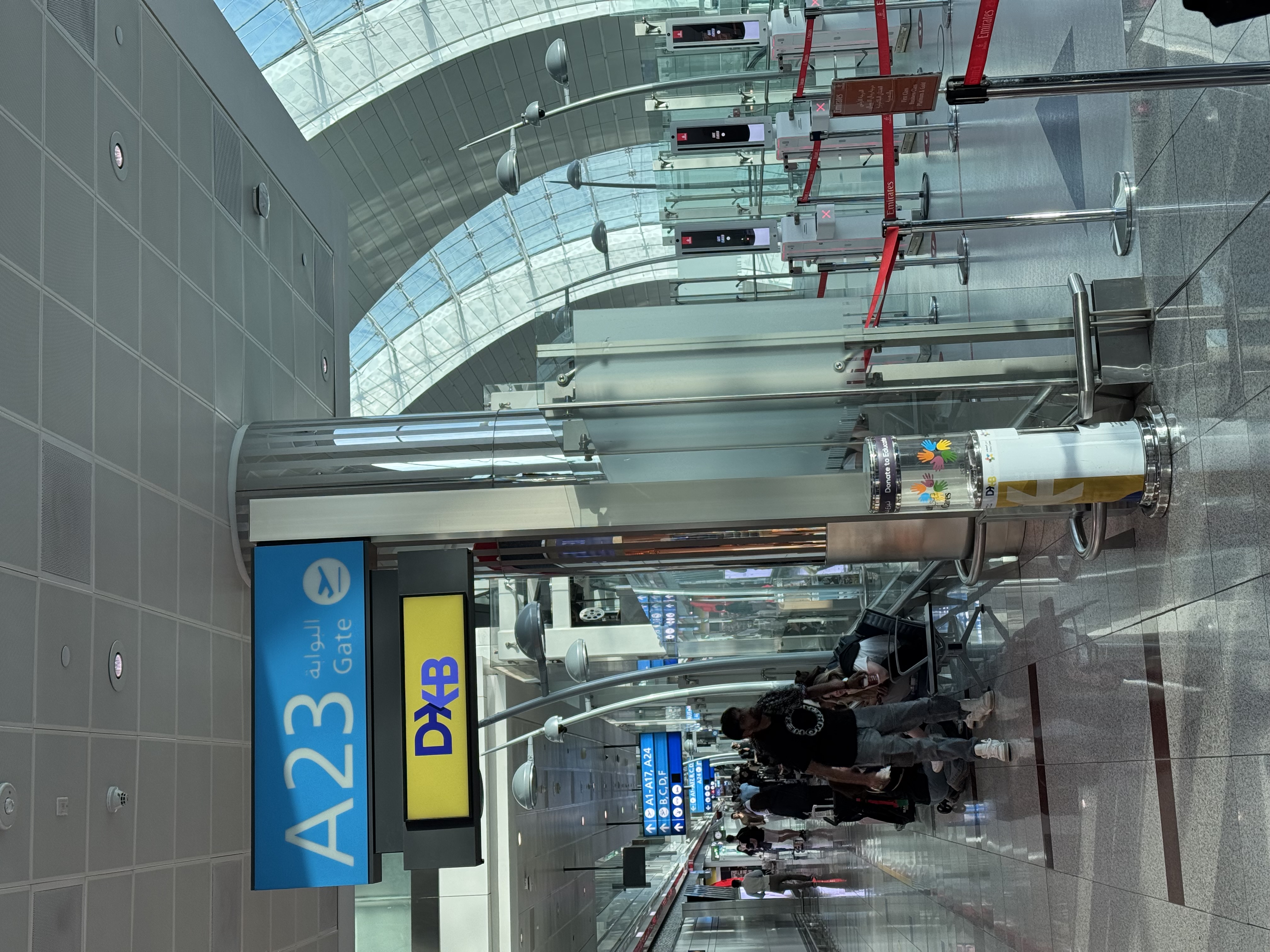 Arrived in Dubai — Gate A23 under the great glass roof of DXB.