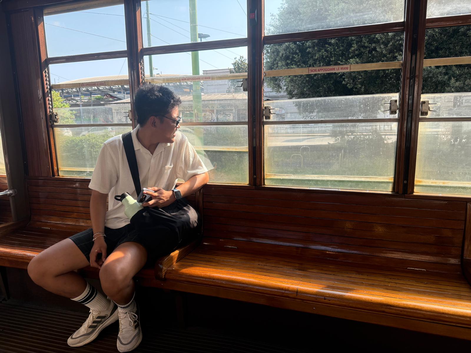 Riding an old wooden tram into the city
