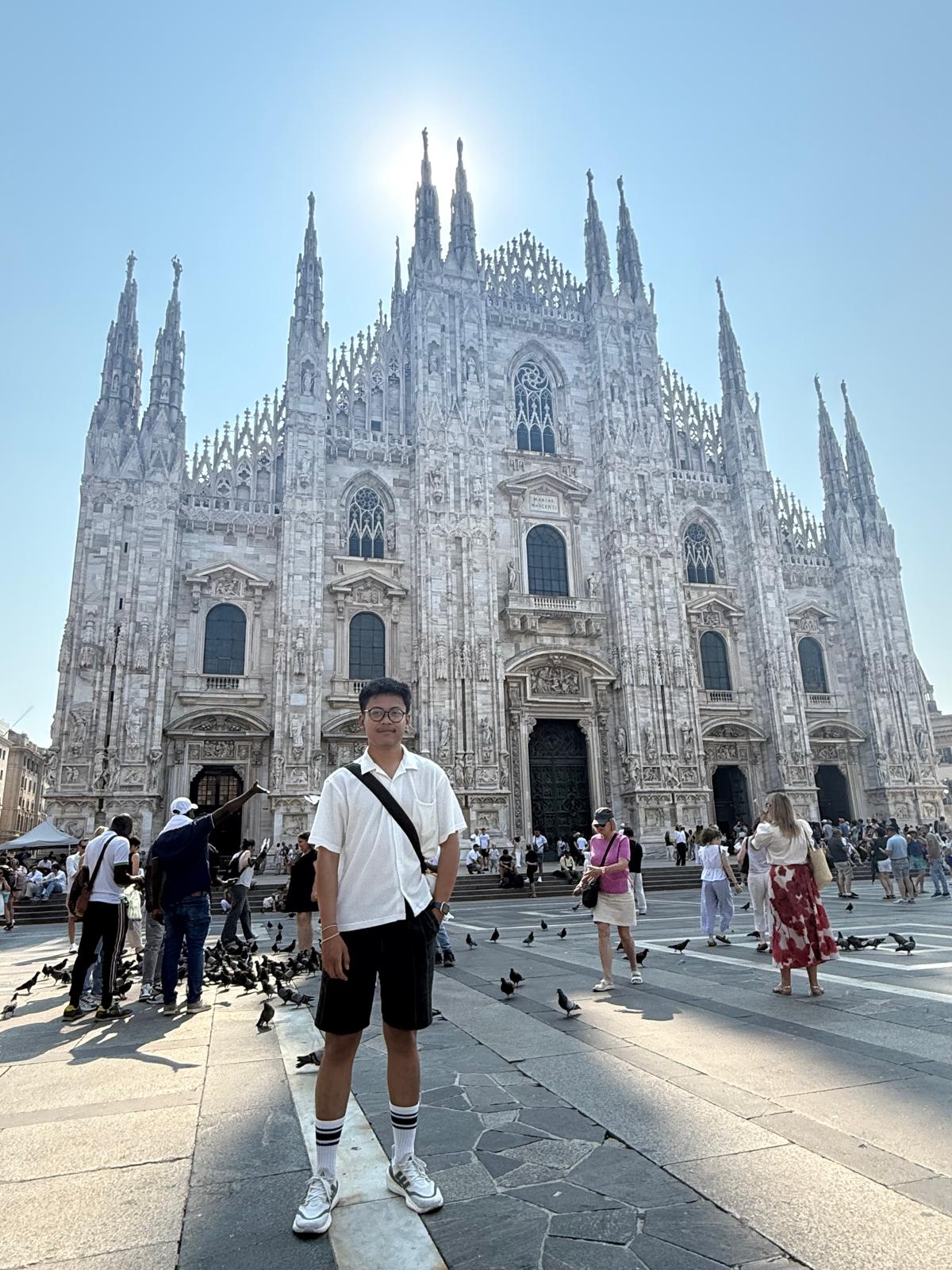 Standing tiny in front of the giant Duomo