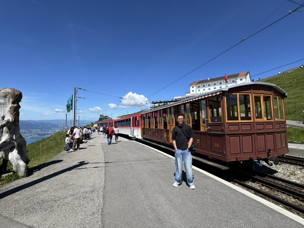 Standing beside the old red cog train at Rigi Kulm.