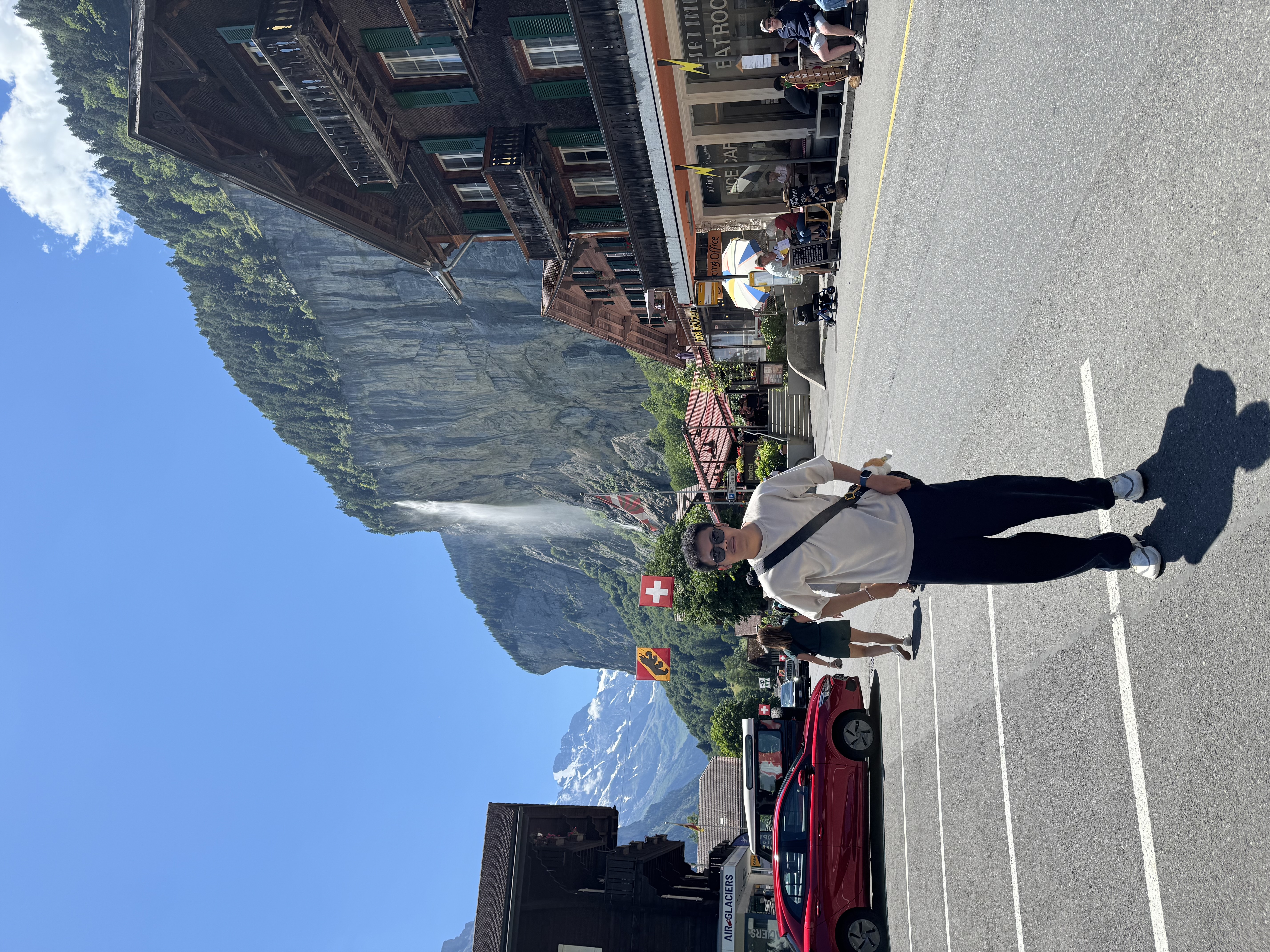 Standing on the main street, the waterfall right behind me.