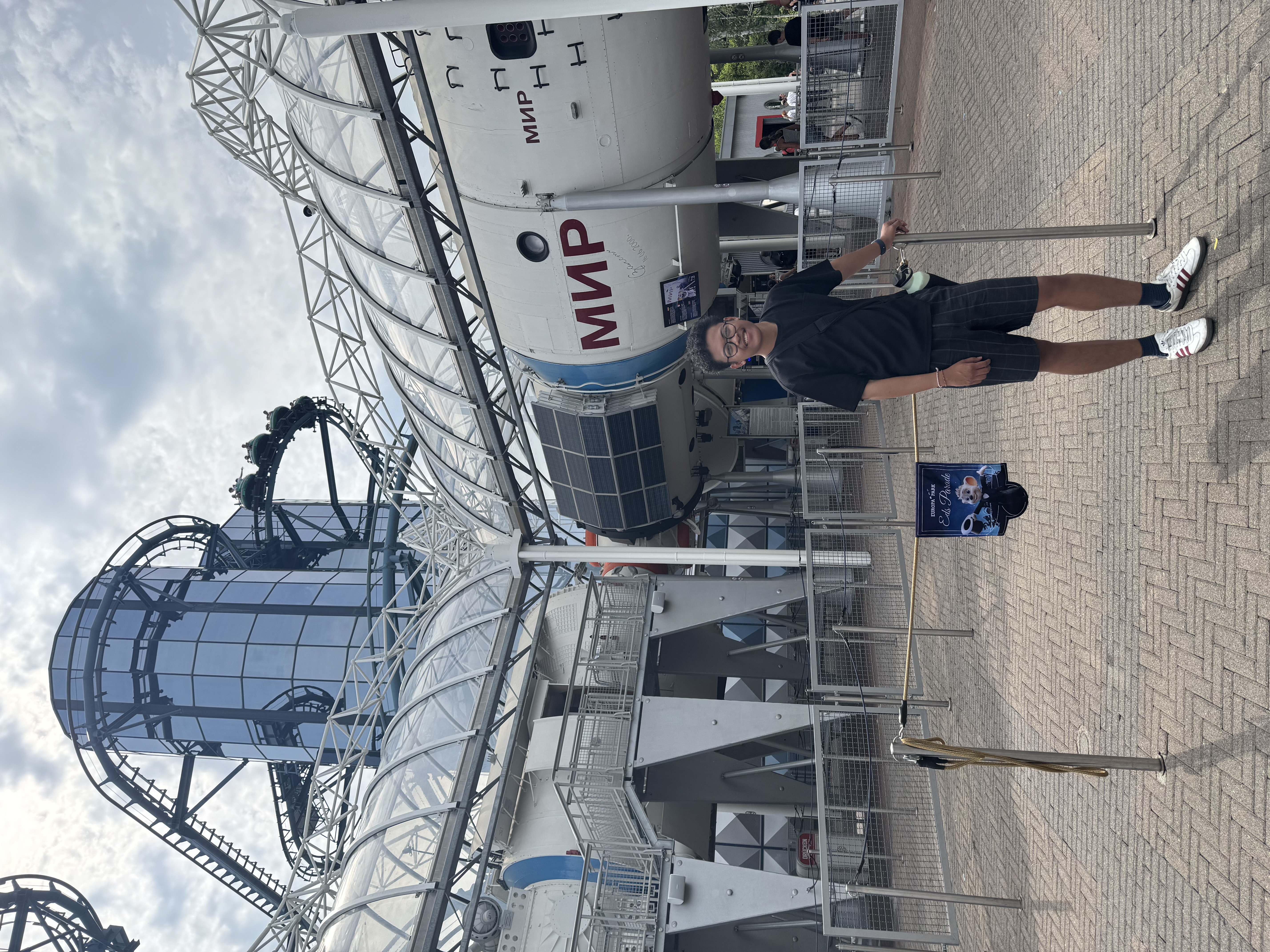 Standing in front of the Mir space station in the Russia area.